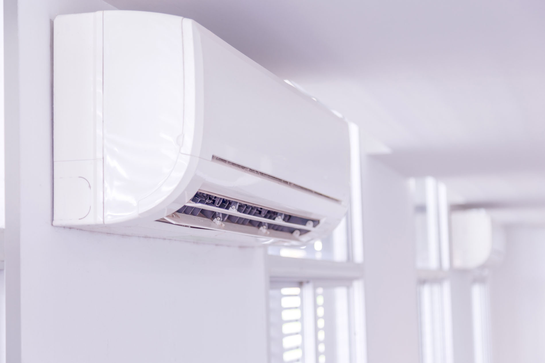 Split system air conditioner mounted on wall in side the room