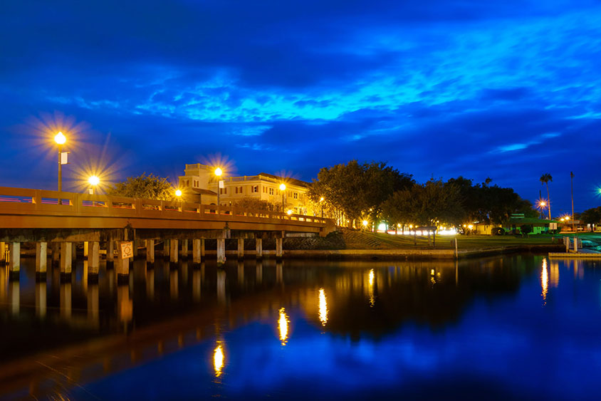 Photo of the main Street Bridge over the Pithlachascotee River in downtown New Port Richey, Pasco County, Florida, USA at twilight. New Port Richey is a suburban city included in the Tampa-St. Petersburg-Clearwater, Florida Metropolitan Statistical Area.